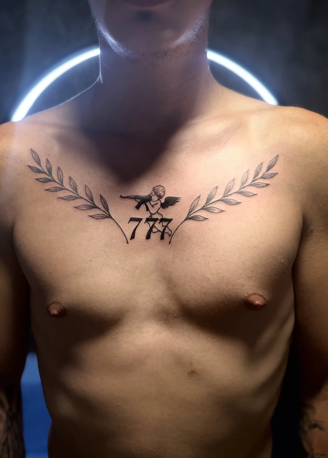 777 chest tattoo
