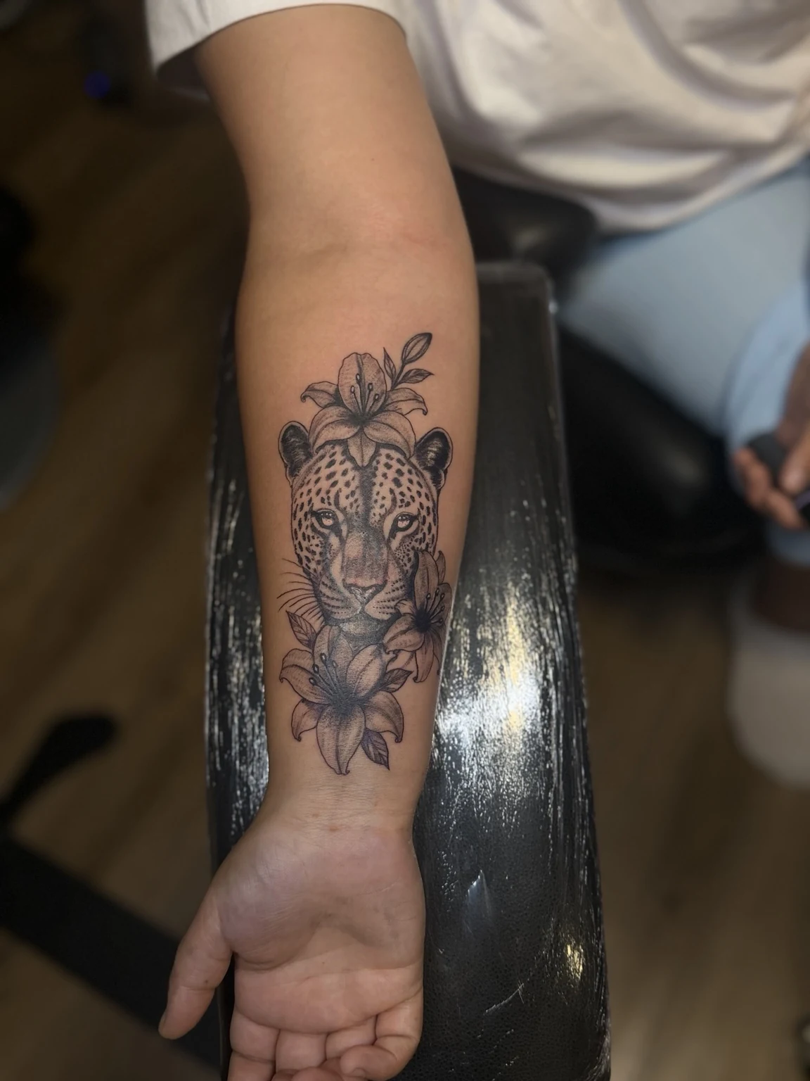 Leopard and flowers tattoo